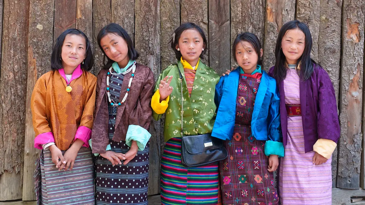 Bhutanese children in traditional dress — under-6s enter Bhutan SDF-free, and children 6–12 pay half