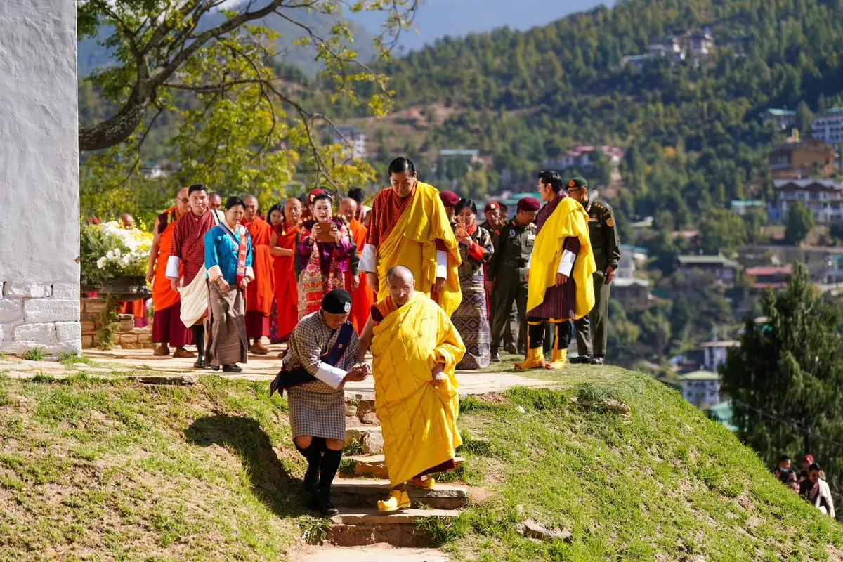 Bhutanese men in traditional gho — the national dress worn daily, by royal example and national etiquette alike