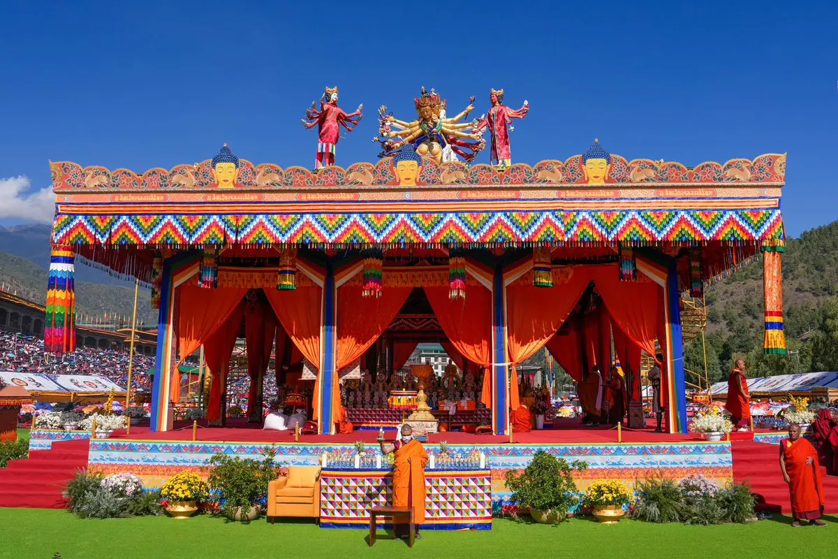 Kalachakra festival performers in traditional regalia at a sacred Bhutanese religious ceremony