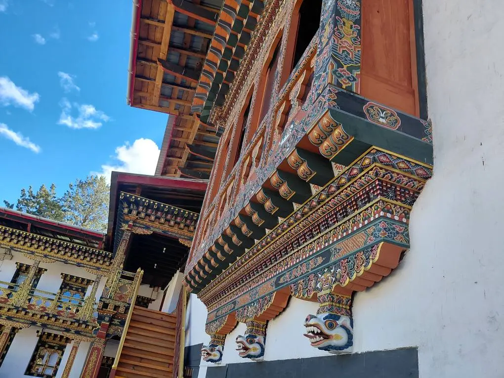 Exterior of a Bhutanese mountain monastery viewed from the trail — the classic photo opportunity at the halfway point to Tiger's Nest