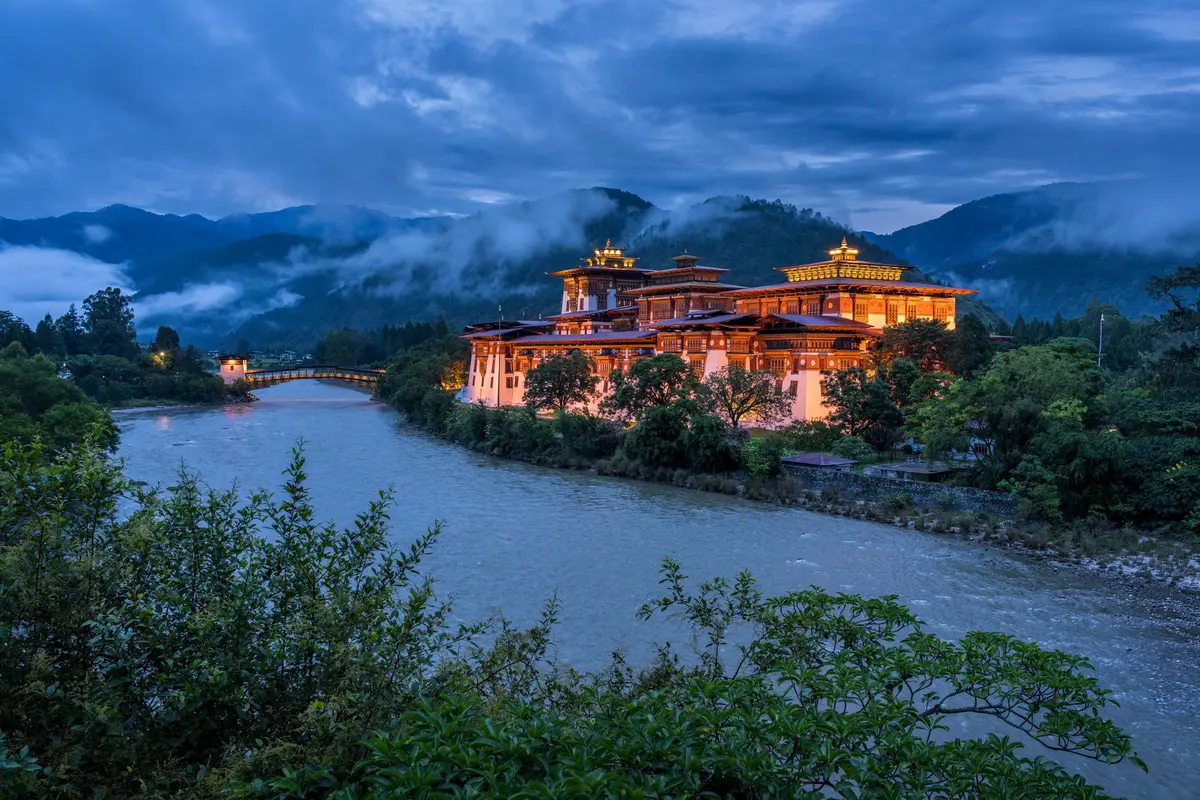 Punakha Dzong at the river confluence — Bhutan's former seat of government, and still the administrative heart of the kingdom's careful approach to tourism