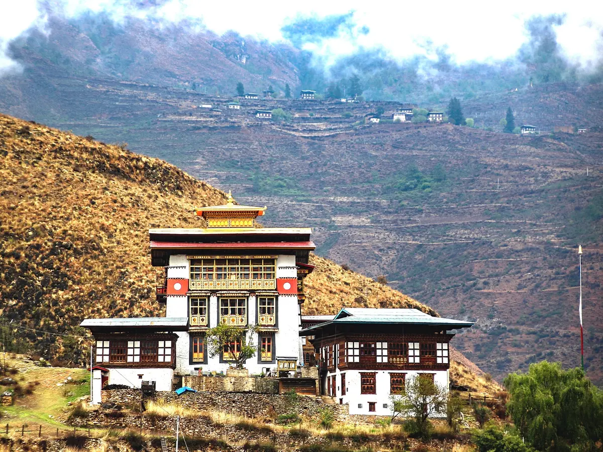 Tachog Lhakhang traditional cantilever bridge and tower in Paro — a medieval wooden structure built without nails using the same joinery as the great dzongs